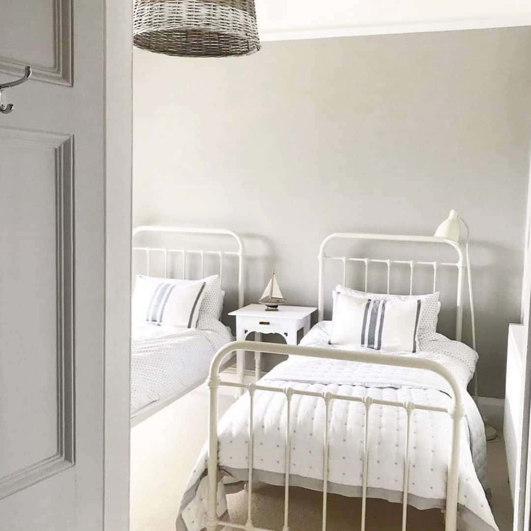 13 of  Small Neutral Bedroom with Two Wrought Iron Beds