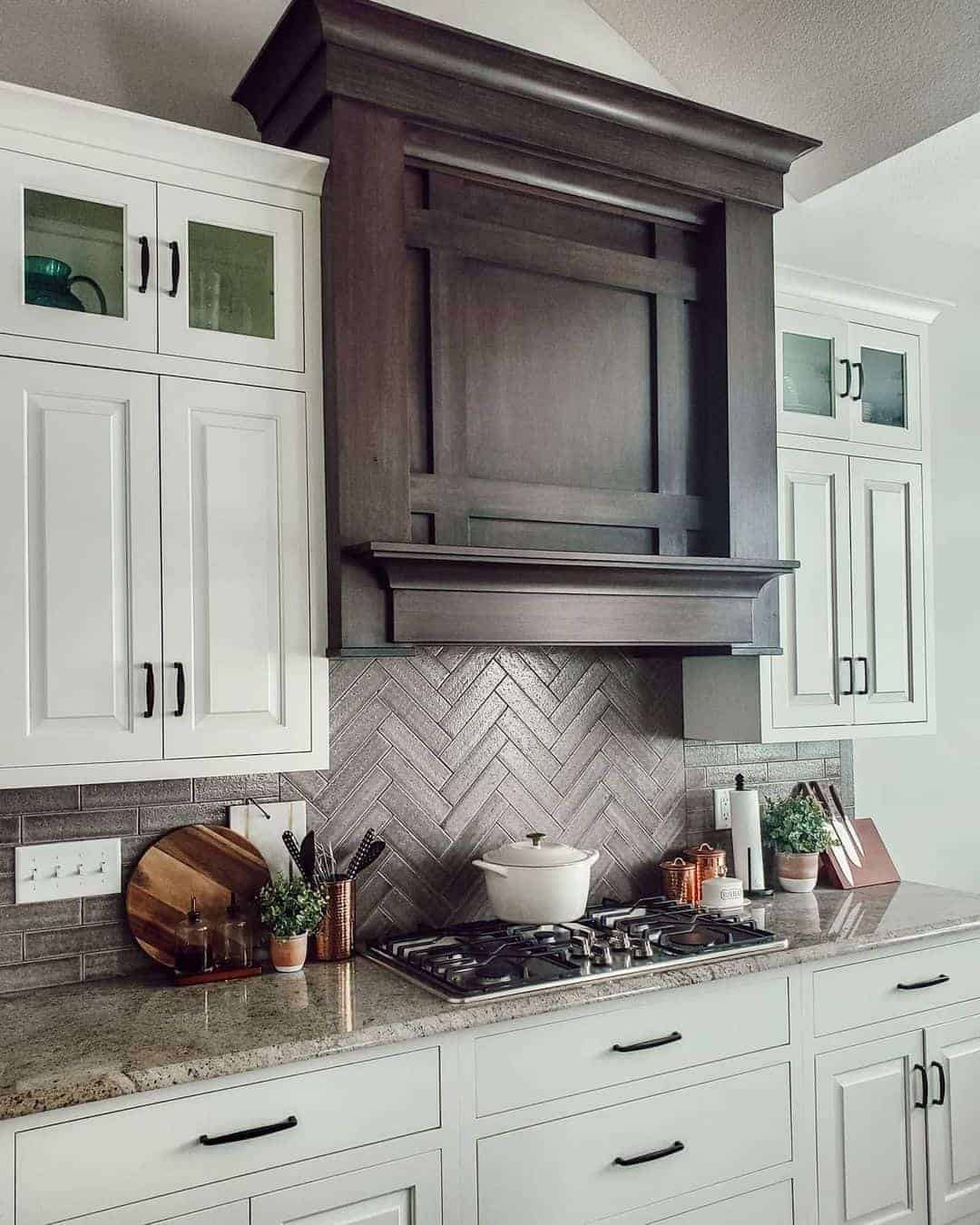 05 of  Herringbone Tile Surrounded by White Cabinets