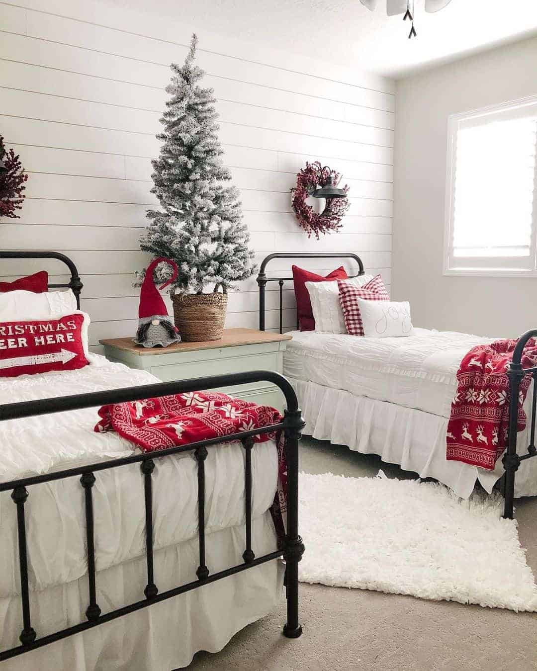 16 of  Parallel Wrought Iron Beds in One Festive Room