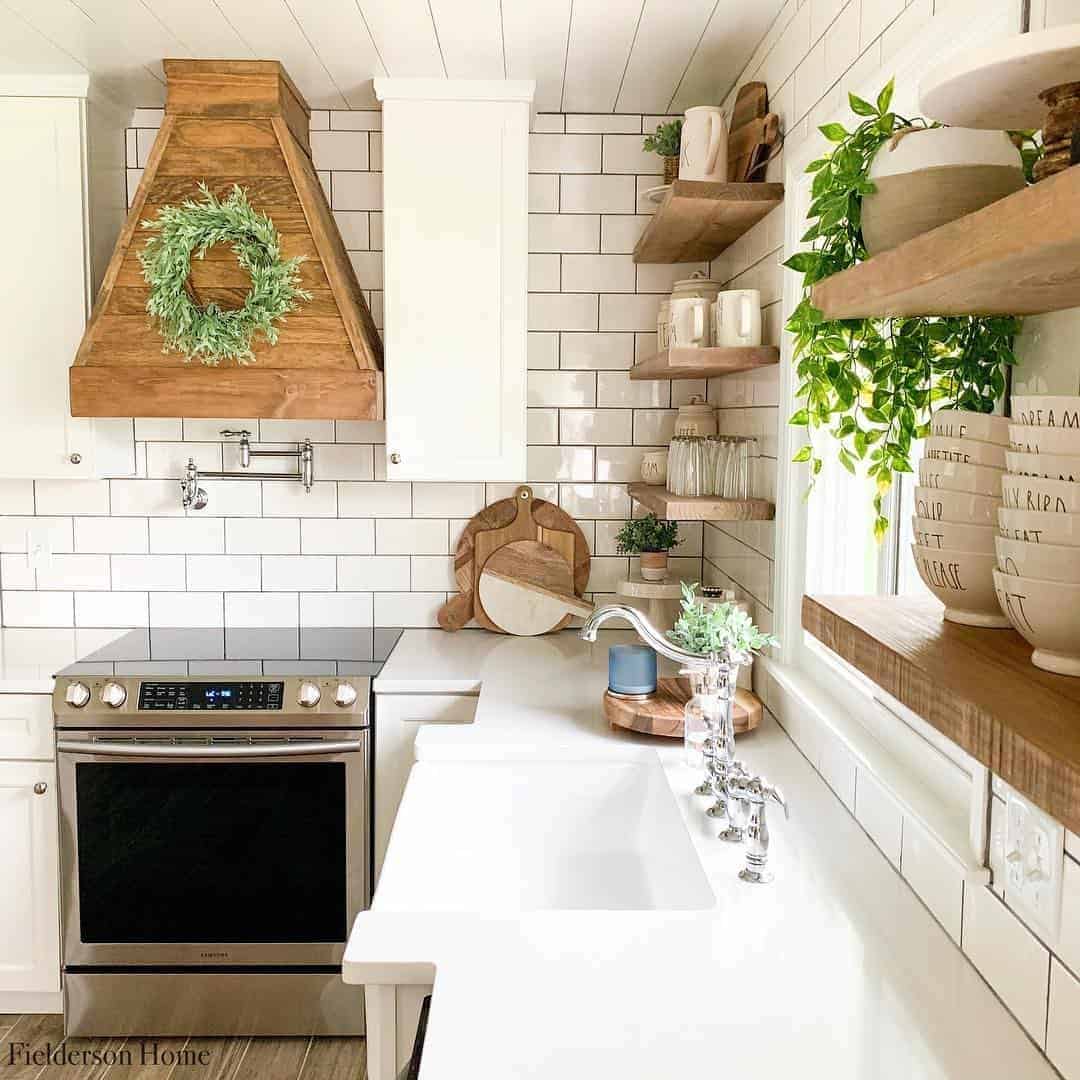 27 of  White Kitchen with Wooden Range Hood and Shelving