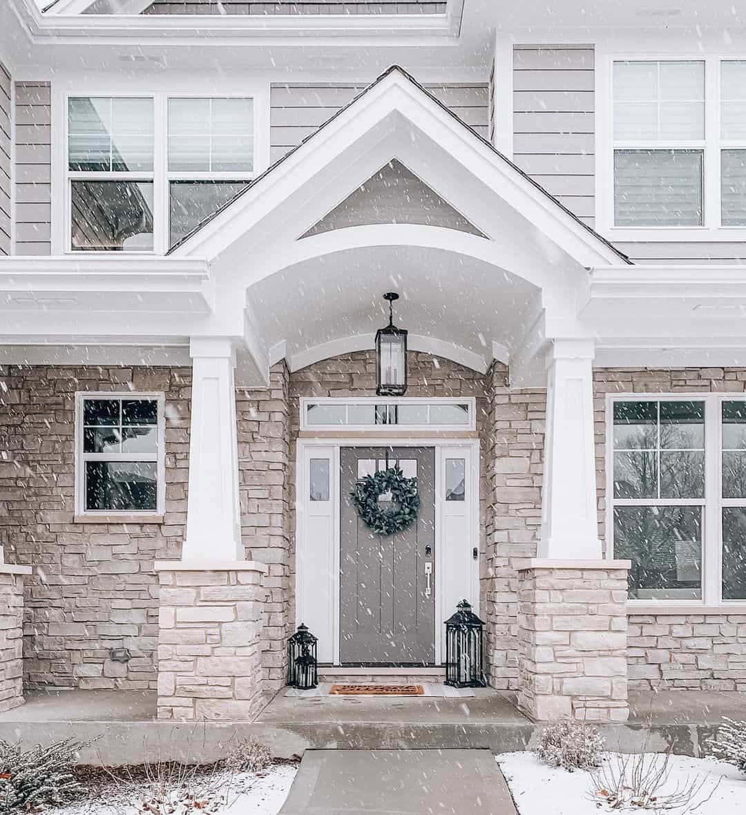 06 of  Beige Stone Home With Winter Door Decorations