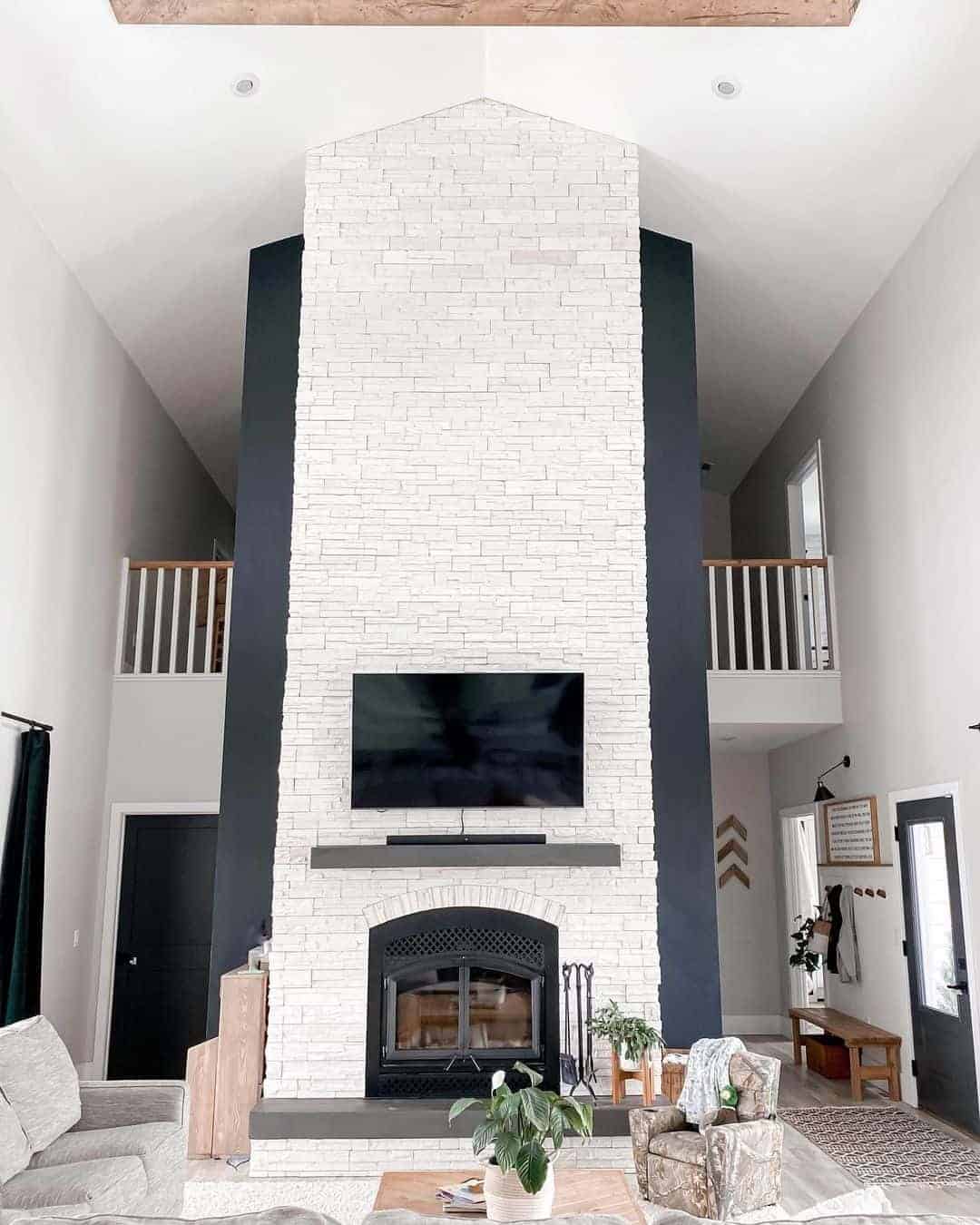 05 of  Black Living Room Wall with White Stone 2 Story Fireplace