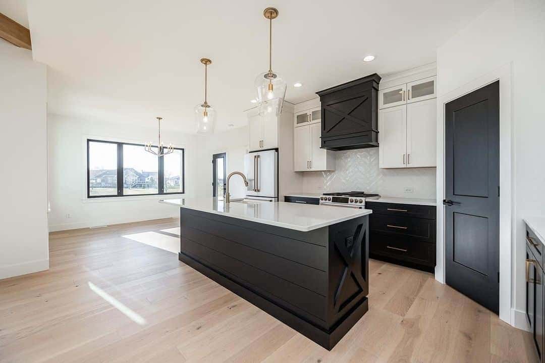 04 of  Modern Black and White Farmhouse Kitchen With Wooden Floor