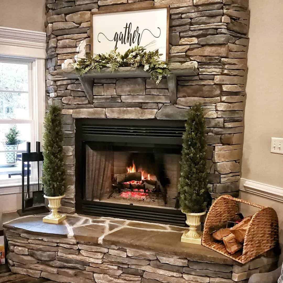 35 of  A White Sign and Green Foliage on a Wooden Mantel