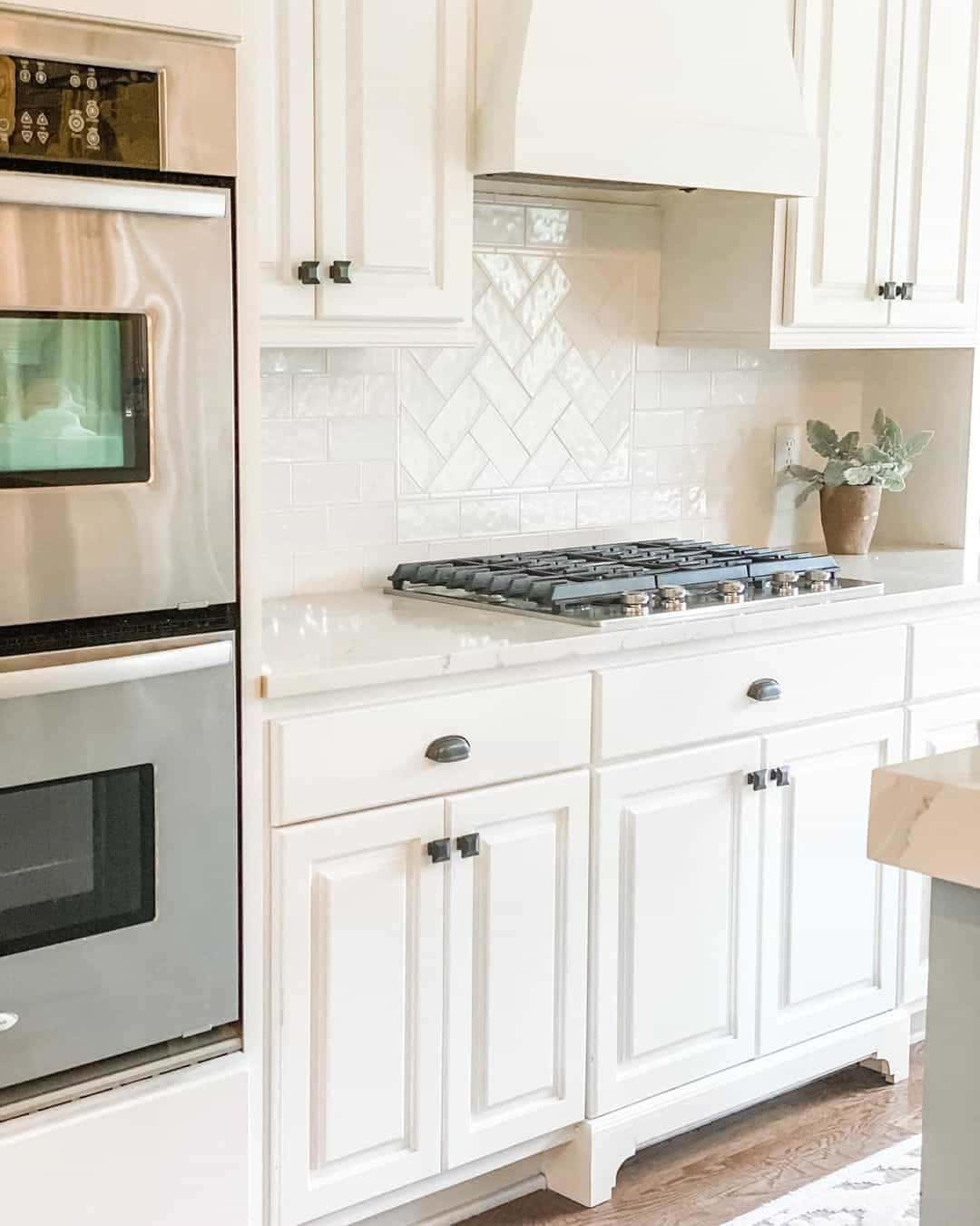 14 of  Pristine White Kitchen with Herringbone Backsplash