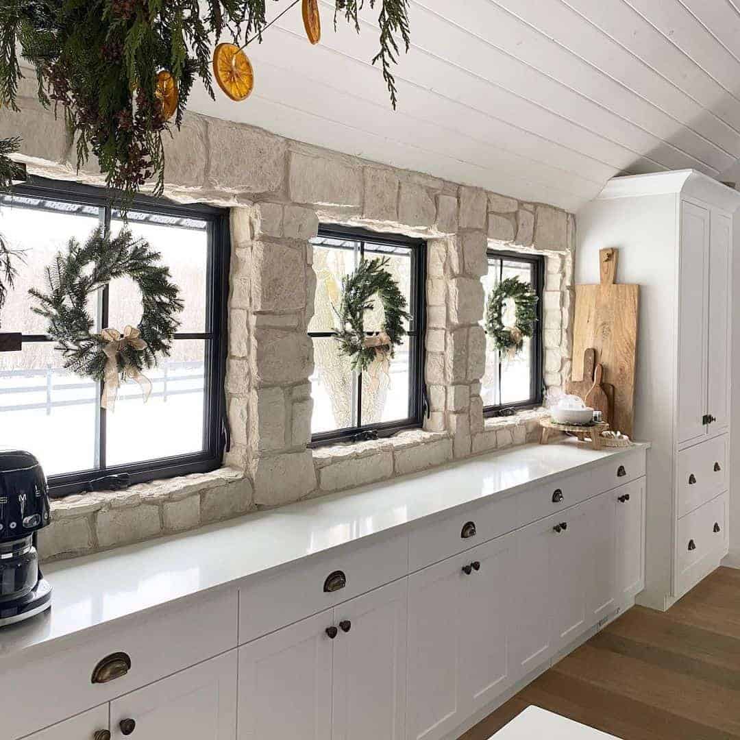 10 of  Wreaths on Windows in a Natural Stone Kitchen