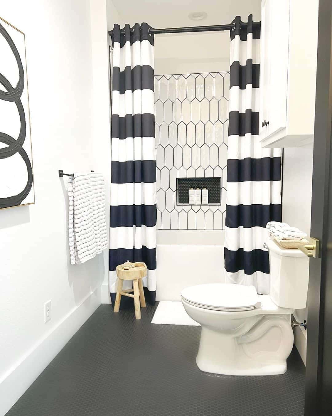 11 of  White Picket Tile Shower With Contrasting Black Details