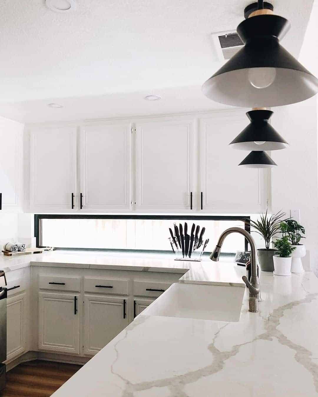 03 of  All White Kitchen With Black Island Lighting